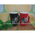 big red and black stoneware cup